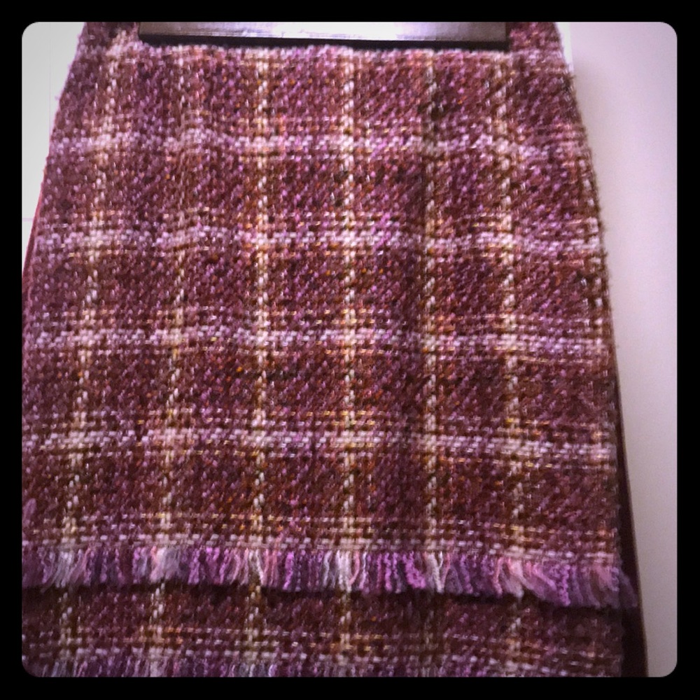 Fringed plaid skirt.